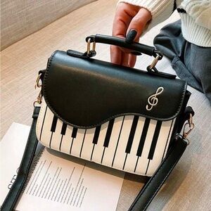 Stylish Black and White Music-Themed Handbag